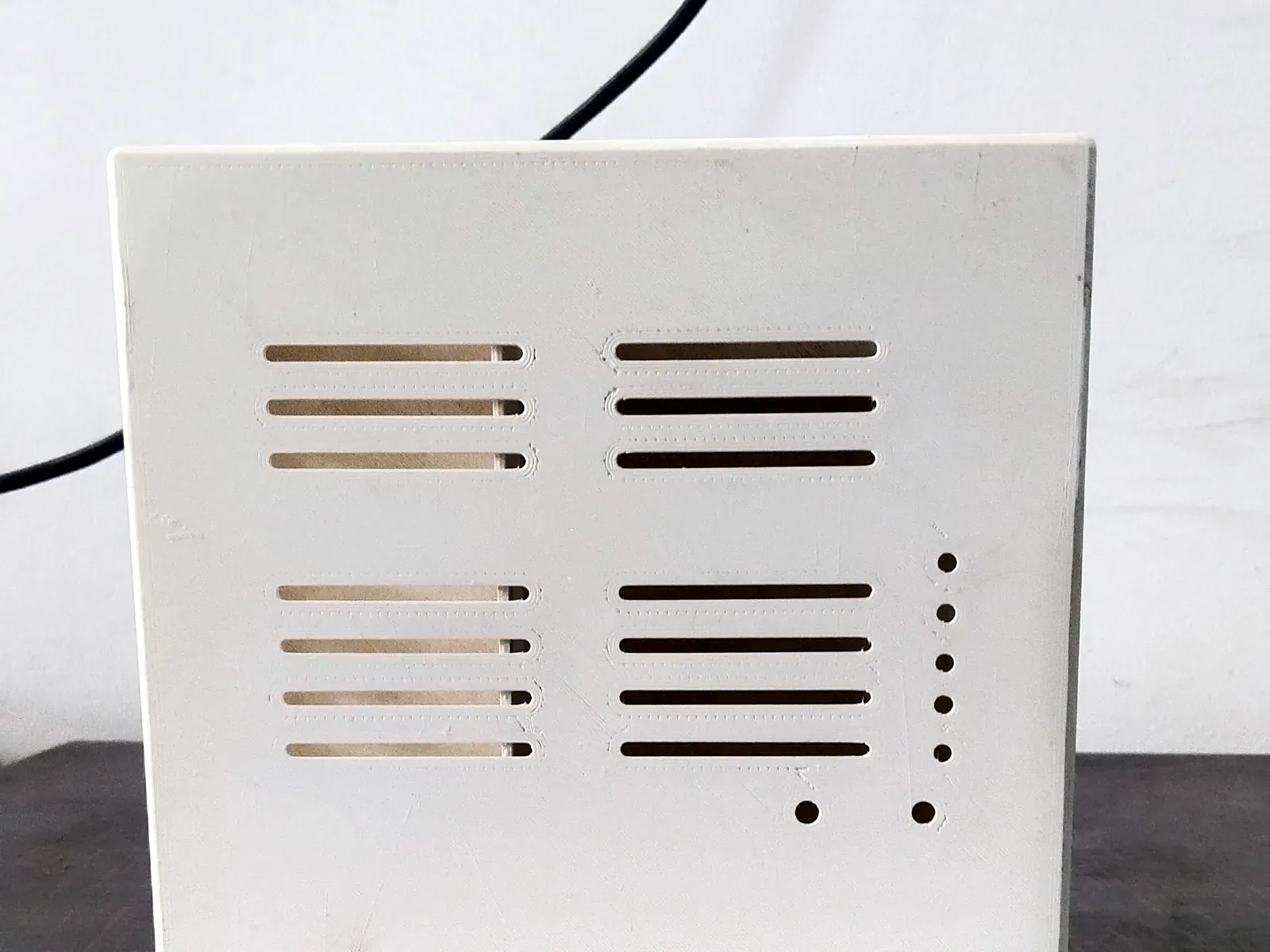White 3D-printed IoT enclosure with vent slots, 163 × 163 × 62 mm